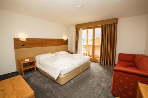 Säng eller sängar i ett rum på Olympic regina hotel
