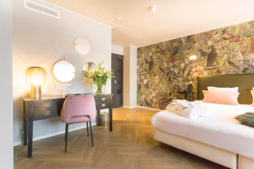 En eller flere senger på et rom på Van der Valk Hotel Avifauna