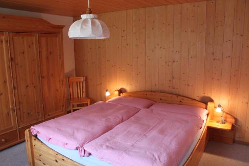 Tempat tidur dalam kamar di Chalet Asterix