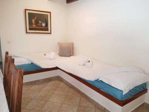 Ένα ή περισσότερα κρεβάτια σε δωμάτιο στο Villa Antoon