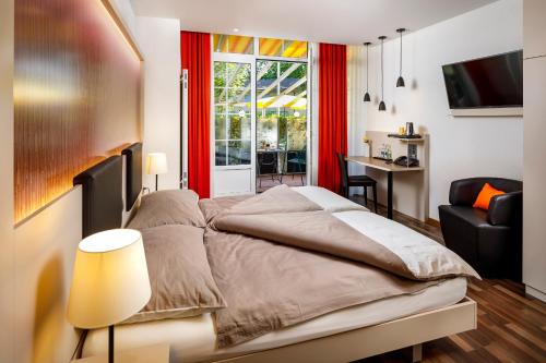 Postel nebo postele na pokoji v ubytování Hotel Jardin Bern