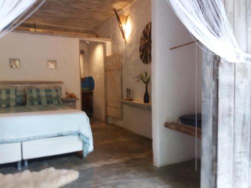 Katil atau katil-katil dalam bilik di Casa Namoa Pousada
