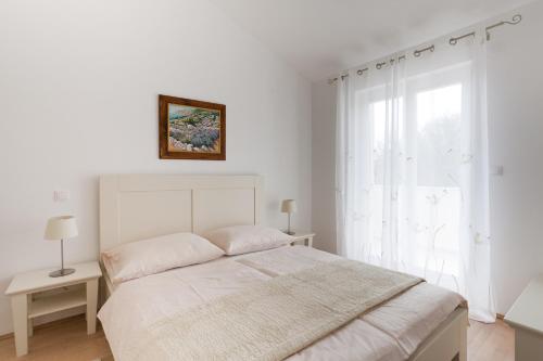Ένα ή περισσότερα κρεβάτια σε δωμάτιο στο Villa Adria