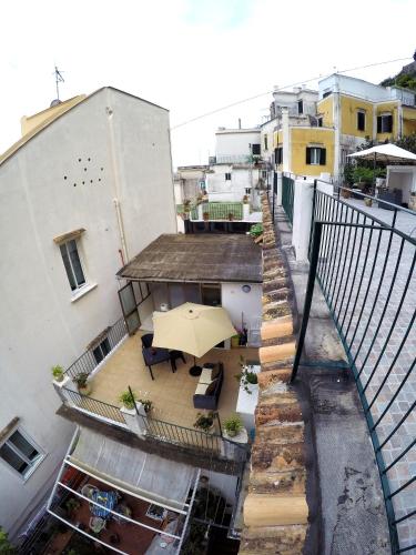 an overhead view of a patio with an umbrella at Nonna Enza Apartment in Atrani