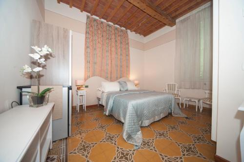Postel nebo postele na pokoji v ubytování Lucca Relais