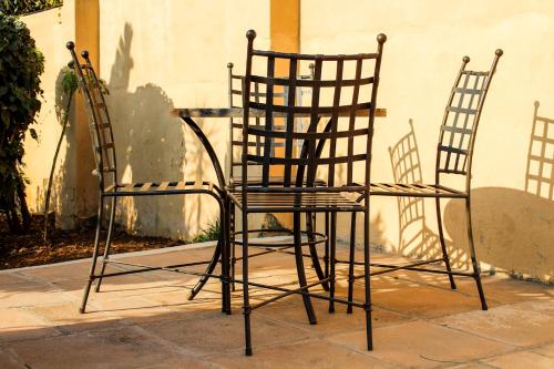 two chairs sitting in front of a table at Damicha Boutique Lodge in Ezulwini