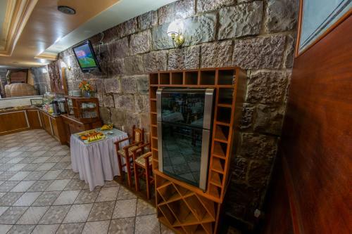 TV a/nebo společenská místnost v ubytování Via Genova Parque Hotel