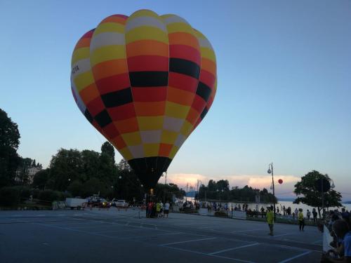 a colorful hot air balloon in a parking lot at Il Planetario in Verbania