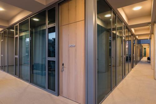 a row of glass doors in a building at Trianon Luxury Apartments & Suites in Chania Town