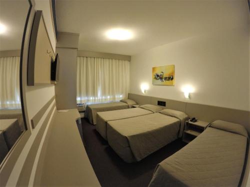 Hotel Gracher Praiaにあるベッド