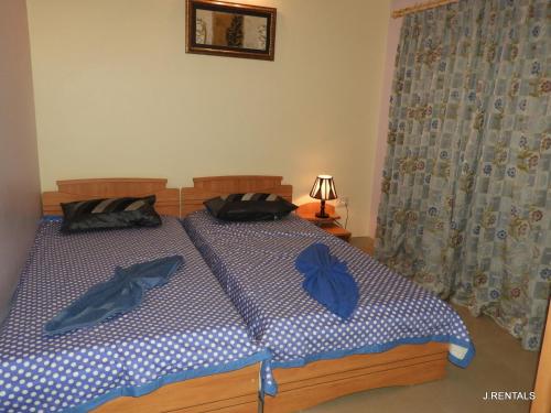 Ένα ή περισσότερα κρεβάτια σε δωμάτιο στο J.RENTALS VILLA 33