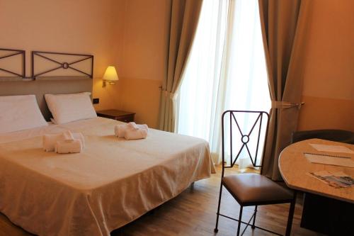 Postel nebo postele na pokoji v ubytování Hotel Semifonte