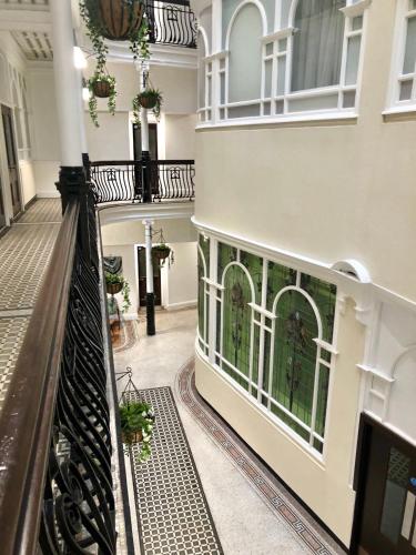 a hallway of a building with a balcony at Terlon Apartments in Liverpool
