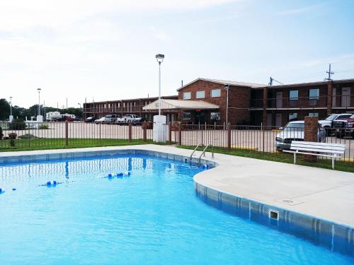 a swimming pool with ducks in the water at Kansas Country Inn in Oakley