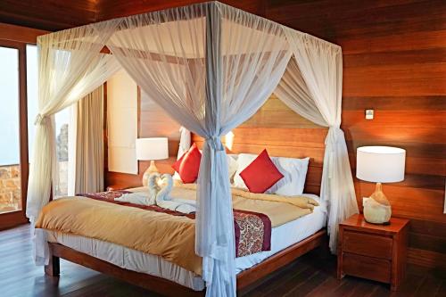 Tempat tidur dalam kamar di Lebak Bali Residence