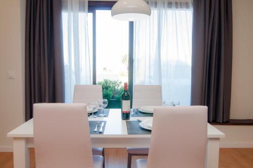 a white table topped with a white table cloth at Los Rodeos Luxury Vivienda Vacacional in Las Lagunas