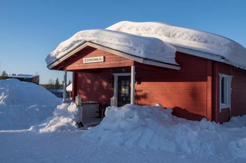 a smallshed covered in snow with snow around it at Ylläksen Yöpuu in Äkäslompolo