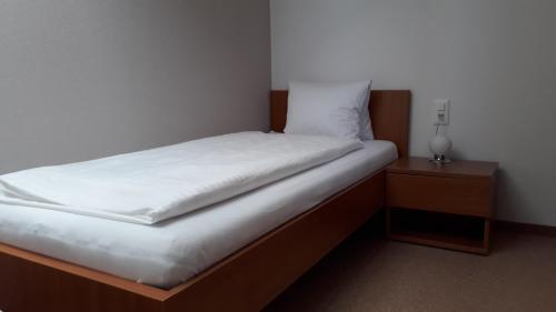
Ein Bett oder Betten in einem Zimmer der Unterkunft Gasthof Seefeld
