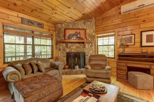 a living room with a couch and a fireplace at River Ranch in Ellijay
