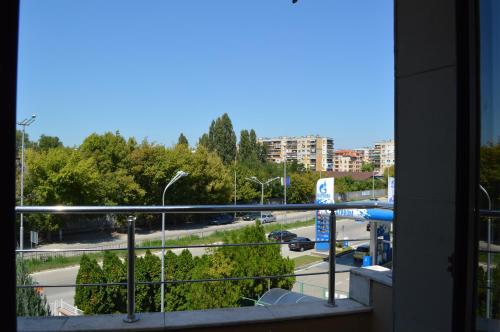 a view of a city street from a balcony at Eos Hotel in Vidin