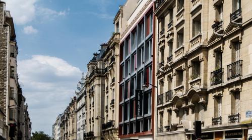 a row of buildings on a city street at Mercure Paris 17 Batignolles in Paris