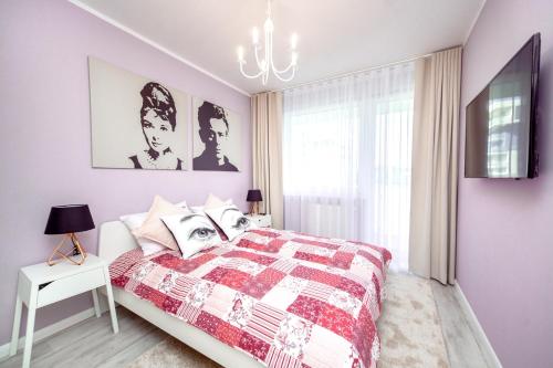 Posteľ alebo postele v izbe v ubytovaní Apartamenty Bliżej Morza