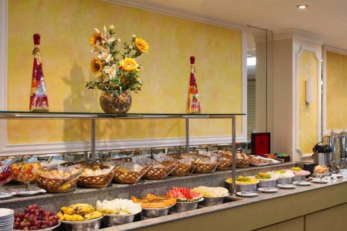 a buffet line with many different types of food at Majestic Rio Palace Hotel in Rio de Janeiro