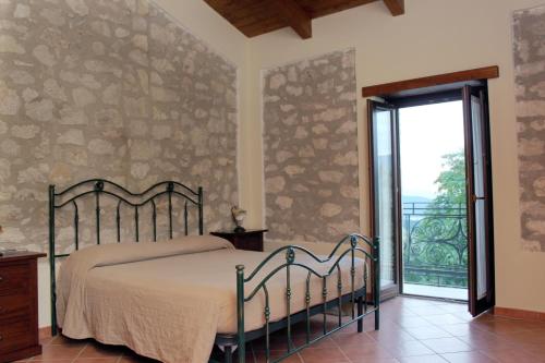 A bed or beds in a room at Masseria Mastrangelo