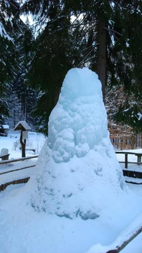 a pile of snow piled on top of a bench at Pension Berghof in Breitenbrunn