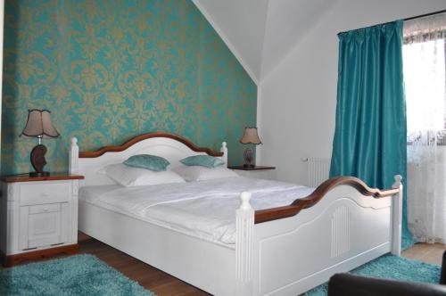 Ένα ή περισσότερα κρεβάτια σε δωμάτιο στο Vila Teoharie