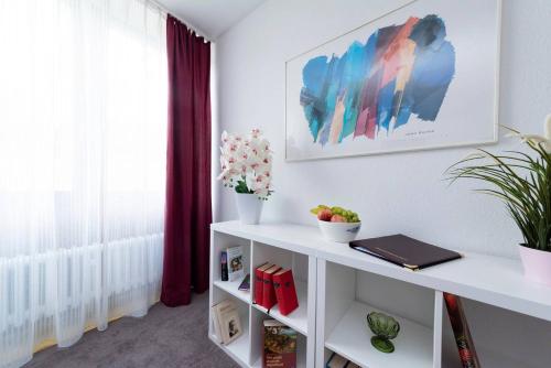 a room with a white table and a window at Bergblick Appartement in Ober-Hambach