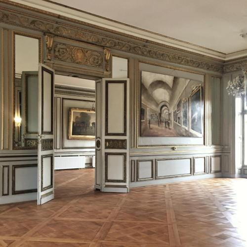 an empty room with paintings on the walls at Château de Pourtalès in Strasbourg
