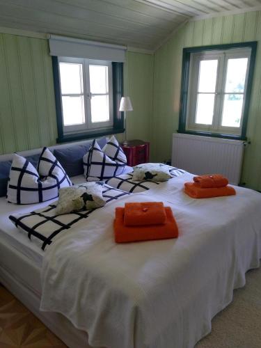 a bedroom with a large bed with two towels on it at Alpchalet Oberstdorf in Oberstdorf