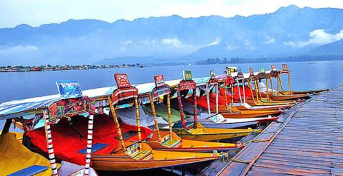 a row of boats lined up on a dock at Kashmir View group of Houseboat in Srinagar