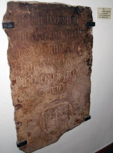 an ancient document with writing on a wall at Hotel Passauer Wolf in Passau