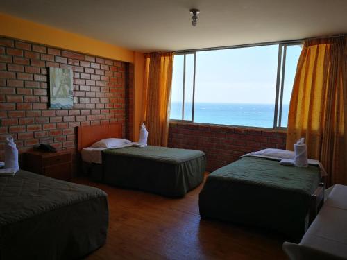 Posteľ alebo postele v izbe v ubytovaní Meflo Playa Grande