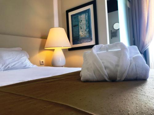 Ένα ή περισσότερα κρεβάτια σε δωμάτιο στο Hotel de Moura