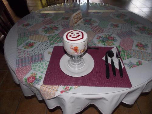 a table with a cake on top of a table at Hotel Casa Duranta in Cobán