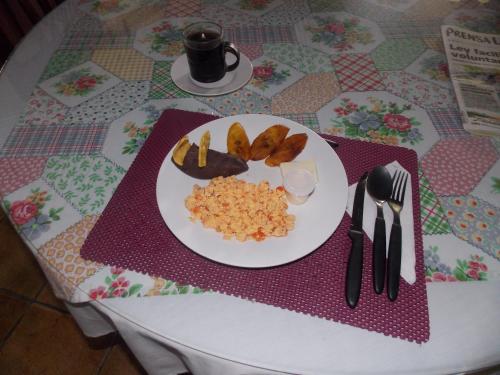 a plate of food on a table with a plate of food at Hotel Casa Duranta in Cobán