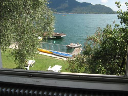 a view of a lake with boats in the water at Freddy Holiday House in Predore