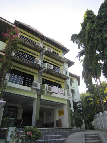 a white building with stairs in front of it at Aonang Top View in Ao Nang Beach