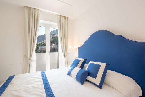Una cama o camas en una habitación de Villa Viviani