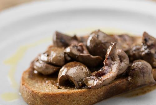 a piece of bread with mushrooms on it at The Black Bull Inn in Sedbergh