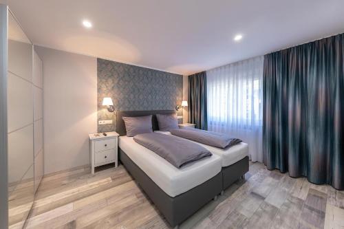 Кровать или кровати в номере Haus Mittelrhein