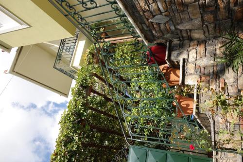 a stairway with plants on the side of a building at Beach Front House With View in Marathos