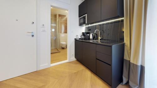 A kitchen or kitchenette at Illyria Luxury Studio Apartments