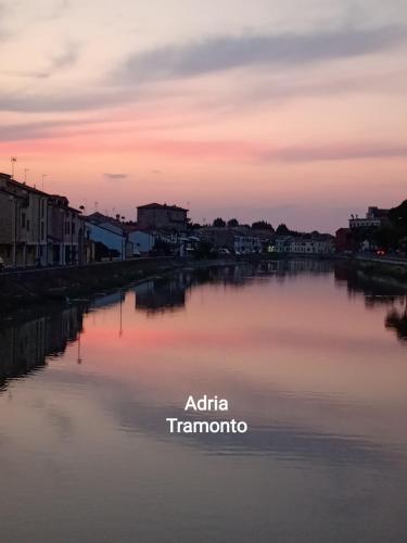 a view of a river at sunset at Adria Bella Locazione Turistica in Adria