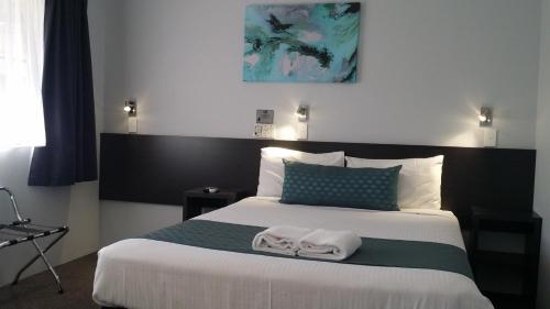 Katil atau katil-katil dalam bilik di Grafton Central Motel