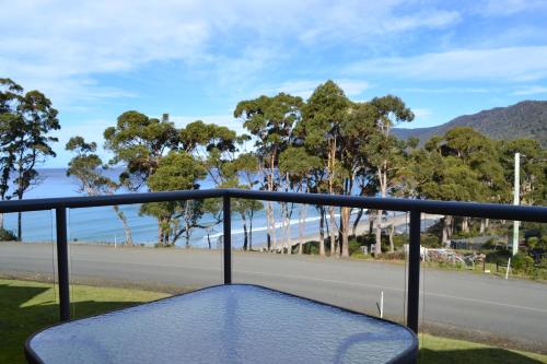 a view of the beach from a balcony at Lufra Hotel and Apartments in Eaglehawk Neck