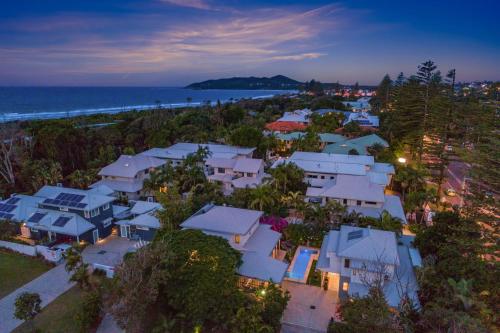 an aerial view of a neighborhood with houses and the ocean at Aaman & Cinta Luxury Villas in Byron Bay